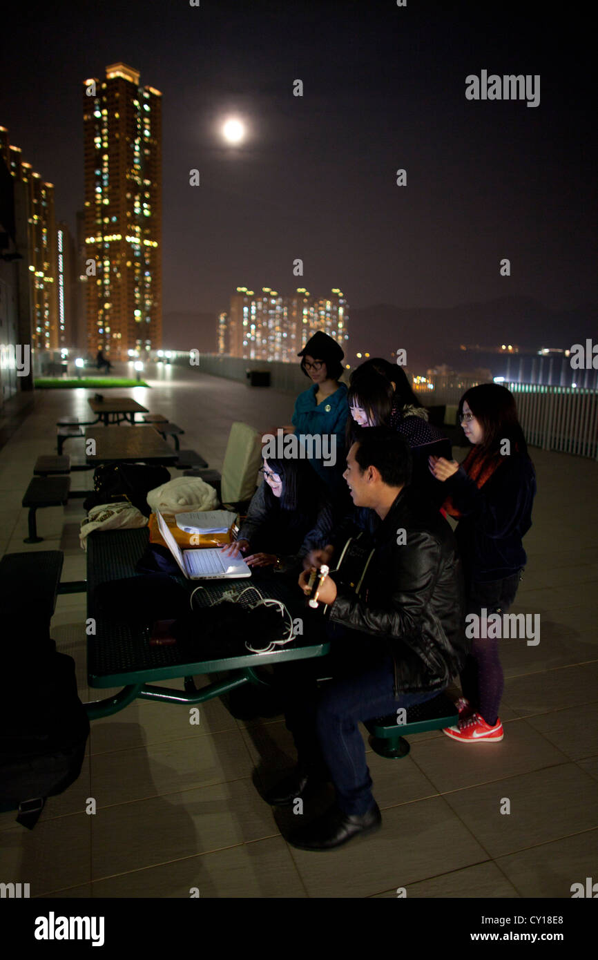 Hongkong youth sining on rooftops Stock Photo