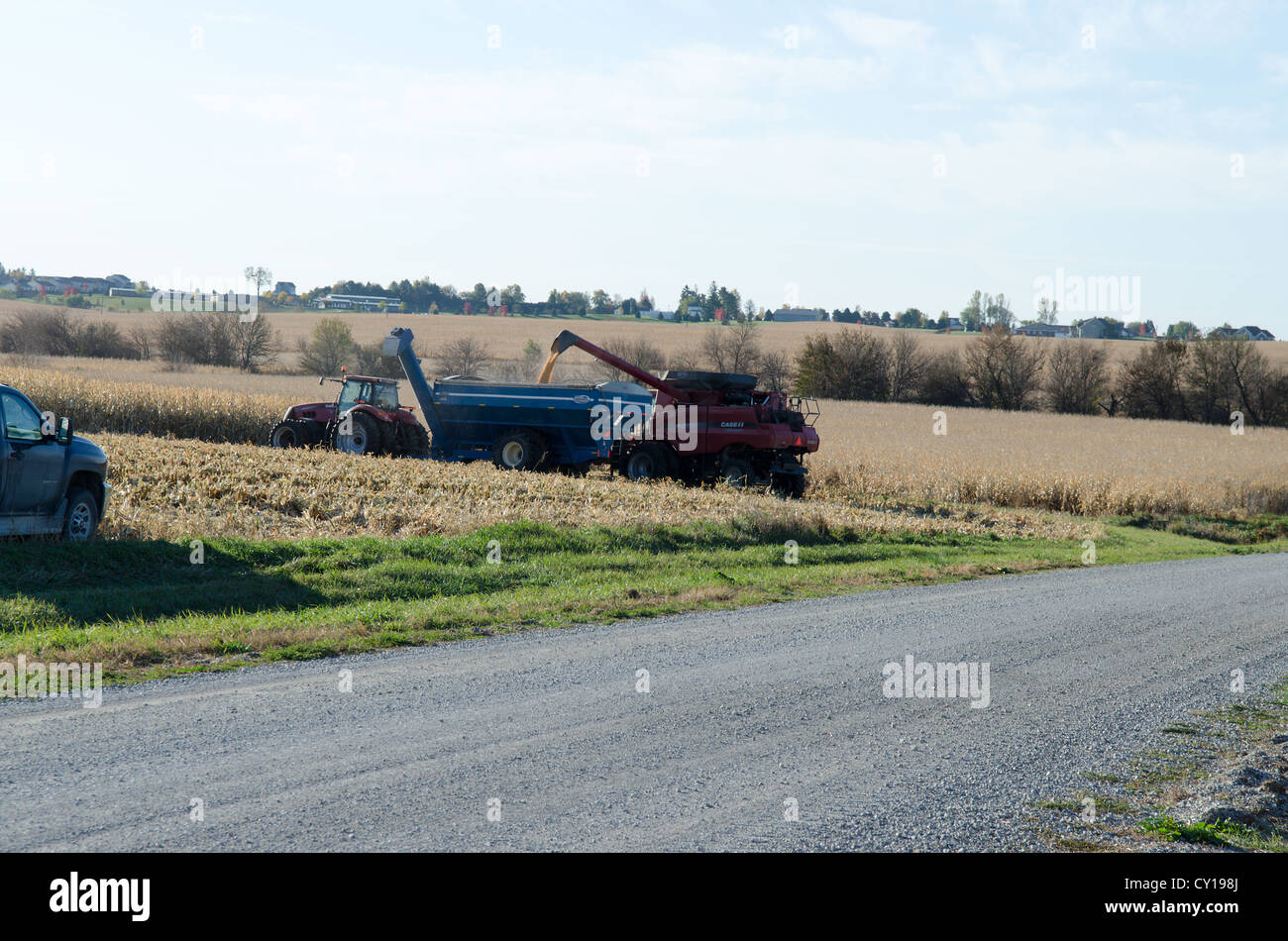 Two Tractors Harvesting American Field Stock Photo - Alamy