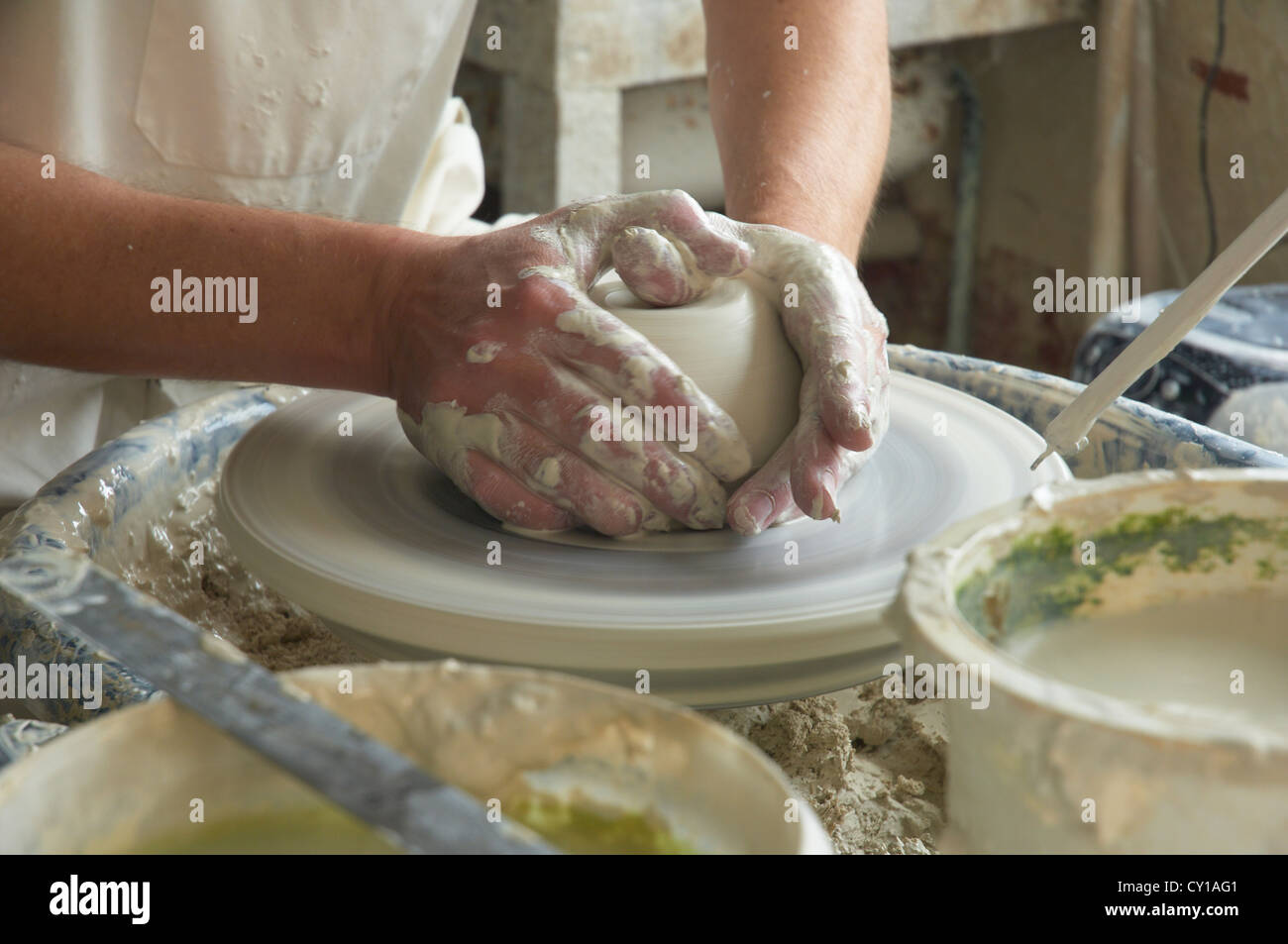 Potter throwing a plate on a wheel, UK Stock Photo Alamy