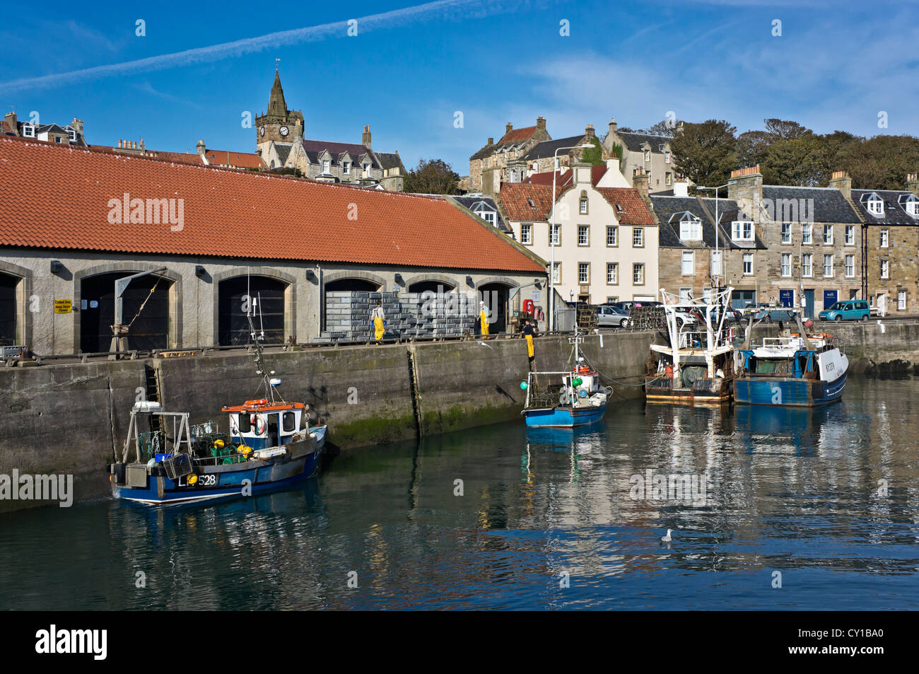 Fishing boats at the Fish Market pier in Pittenweem Harbour Fife Scotland Stock Photo