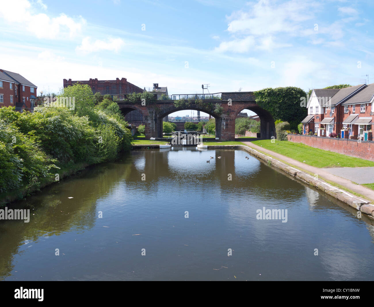 These locks are at the beginning of the Liverpool to Leeds canal and actually lead from the Canal to the river Mersey Stock Photo