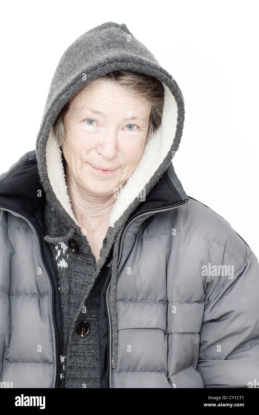 Senior woman in winter clothing, wearing hooded jacket, portrait, smiling Stock Photo Alamy