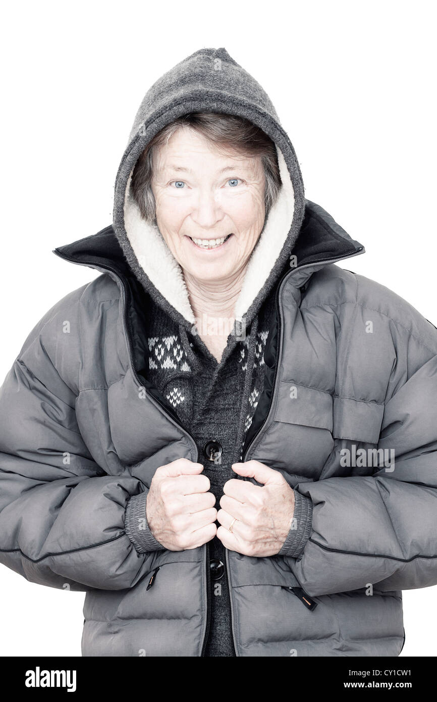 Senior woman in winter clothing, wearing hooded jacket, portrait, smiling Stock Photo Alamy