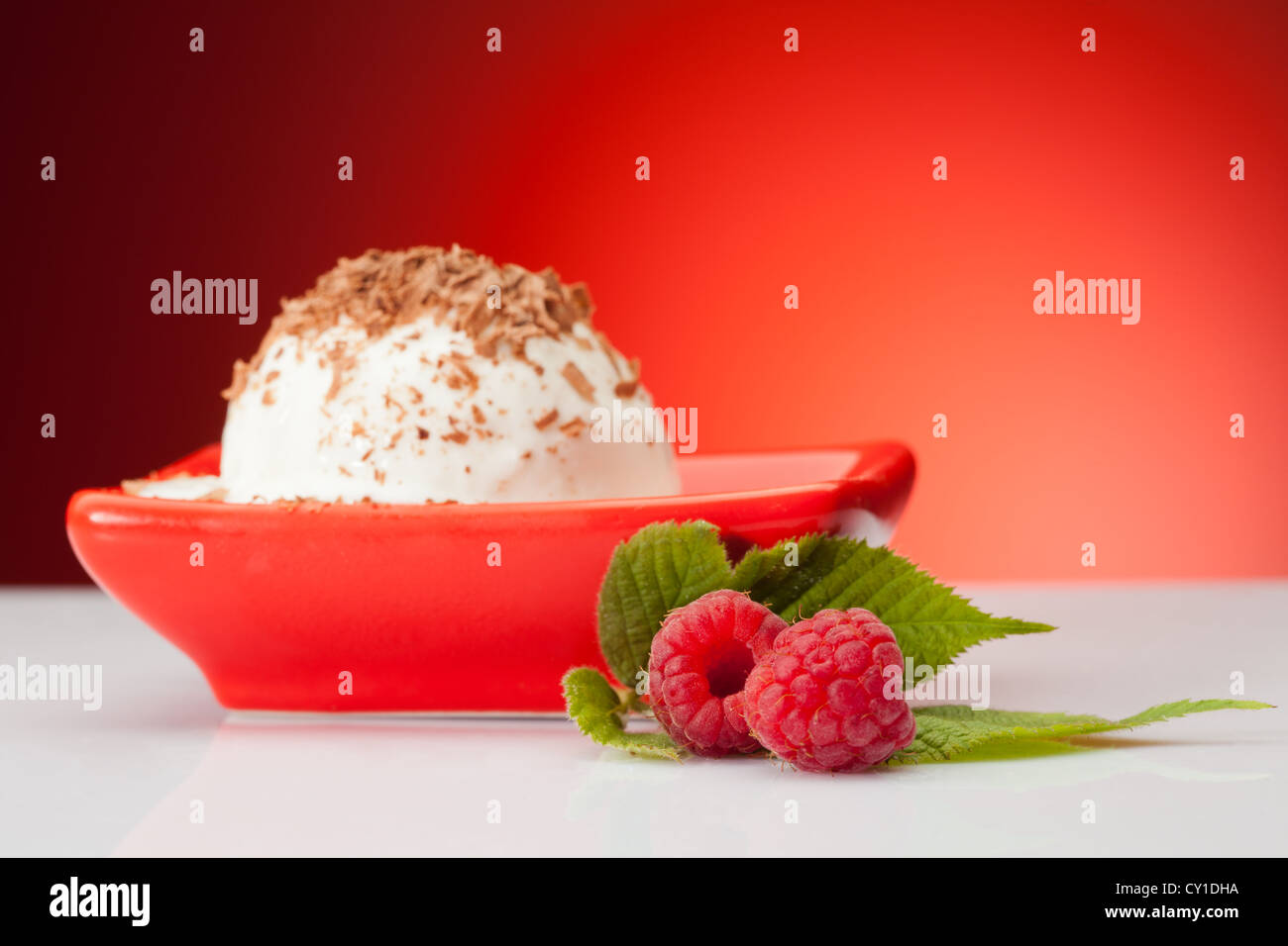 Vanilla Raspberry Background raspberries with vanilla ice cream on red background Stock Photo - Alamy