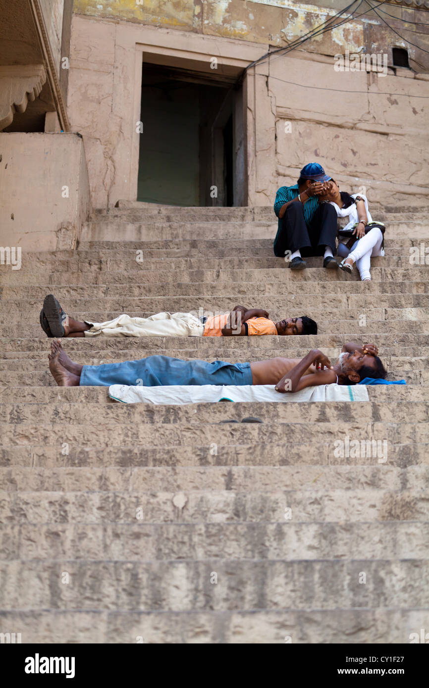 Sleeping on the Stairways at the Ghats in Varanasi, India Stock Photo