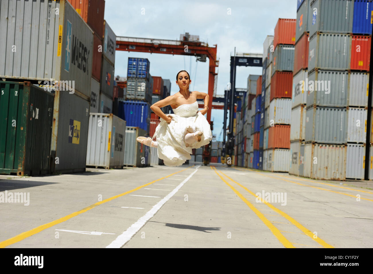National Ballet of Panama dancer in her wedding dress in the city port. Stock Photo