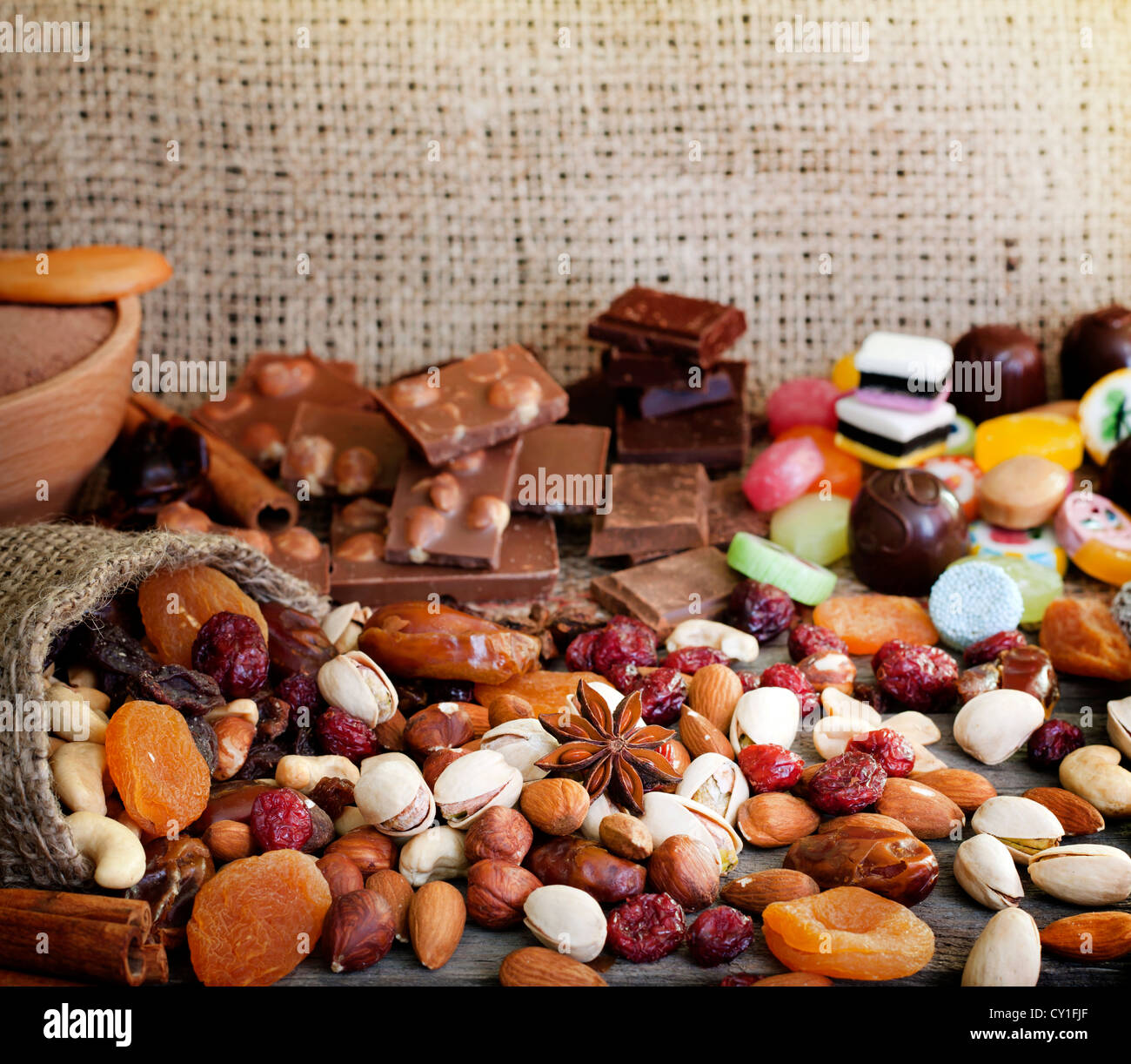 Chocolate nuts dried fruits and candy background Stock Photo Alamy