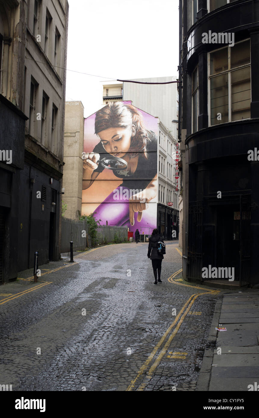 A large graffiti mural by the artist Smug adorns a wall near the centre of Glasgow, Scotland Stock Photo