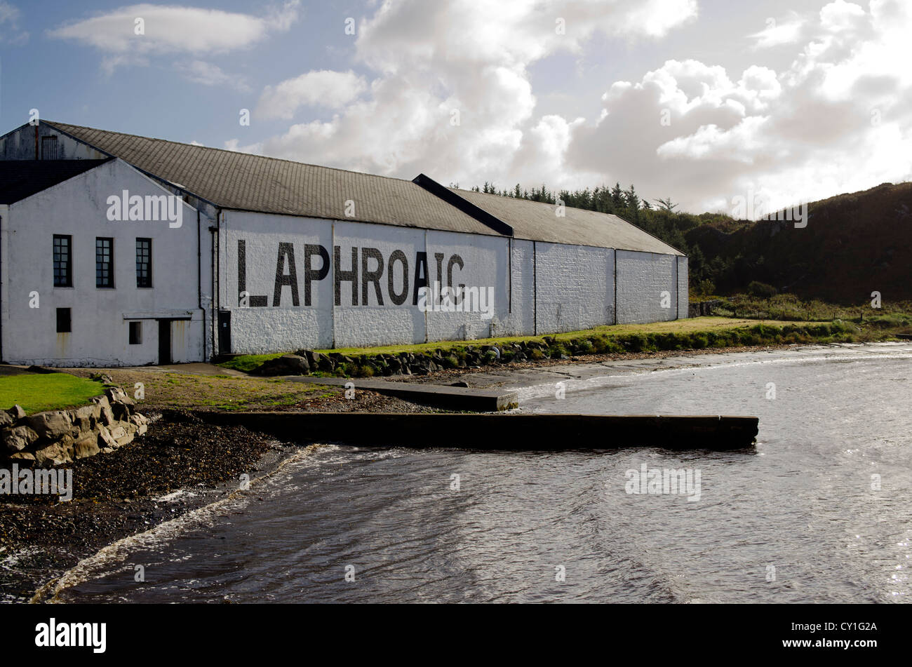 One of the buildings at the Laphroaig malt whisky distillery, Islay, Scotland as seen from the coast. Stock Photo