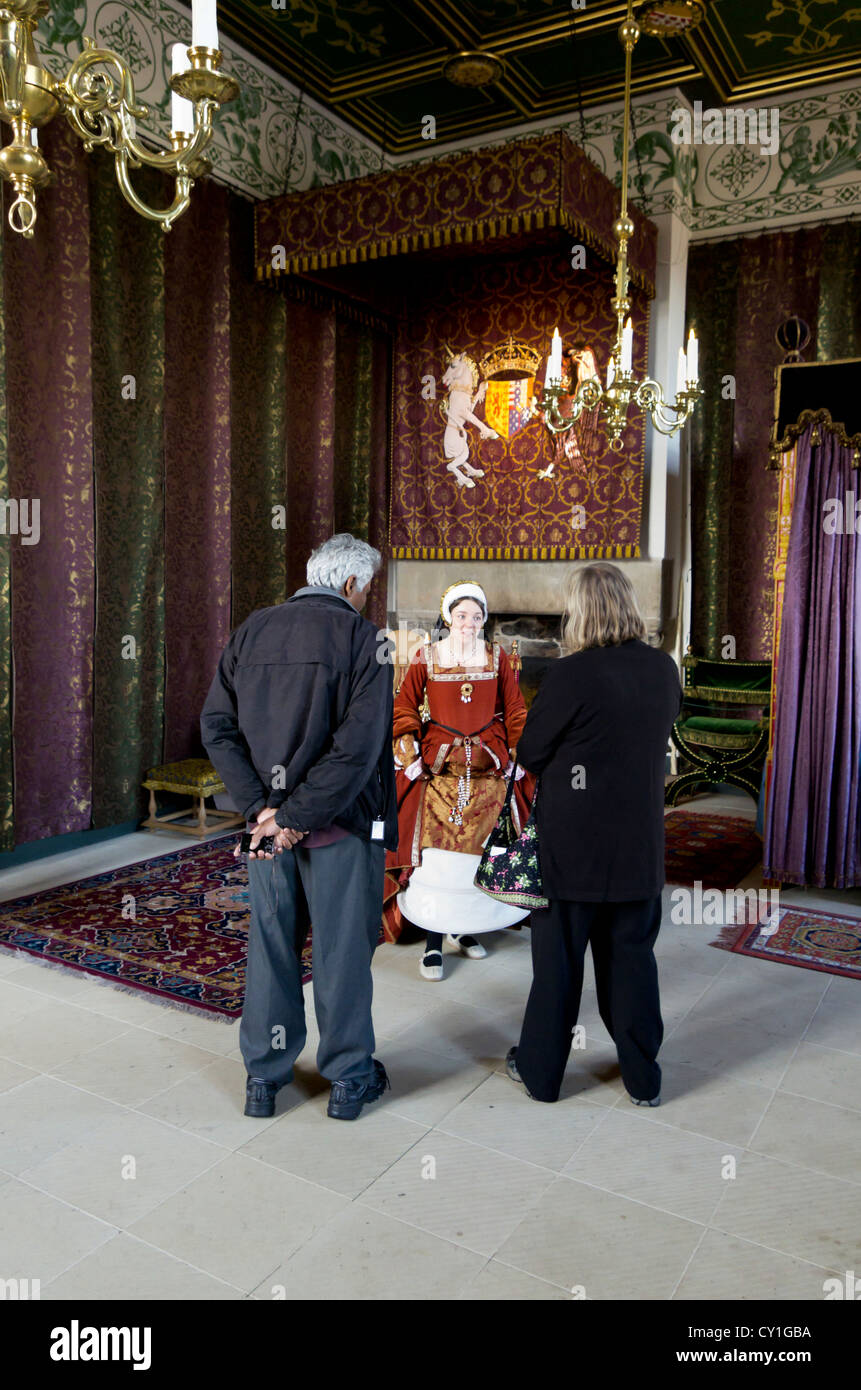 Tourists are given information on traditional dress by a guide at Stirling Castle, Stirling, Scotland Stock Photo