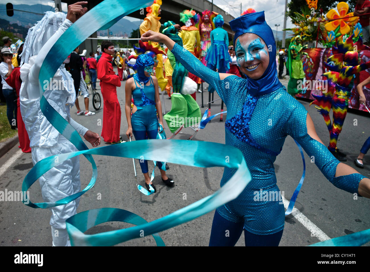 Colorful costumes create an ebullient scene at the Silleteros Parade. Stock Photo