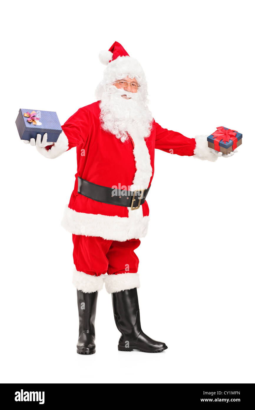 Full length portrait of a Santa Claus offering gifts isolated against ...