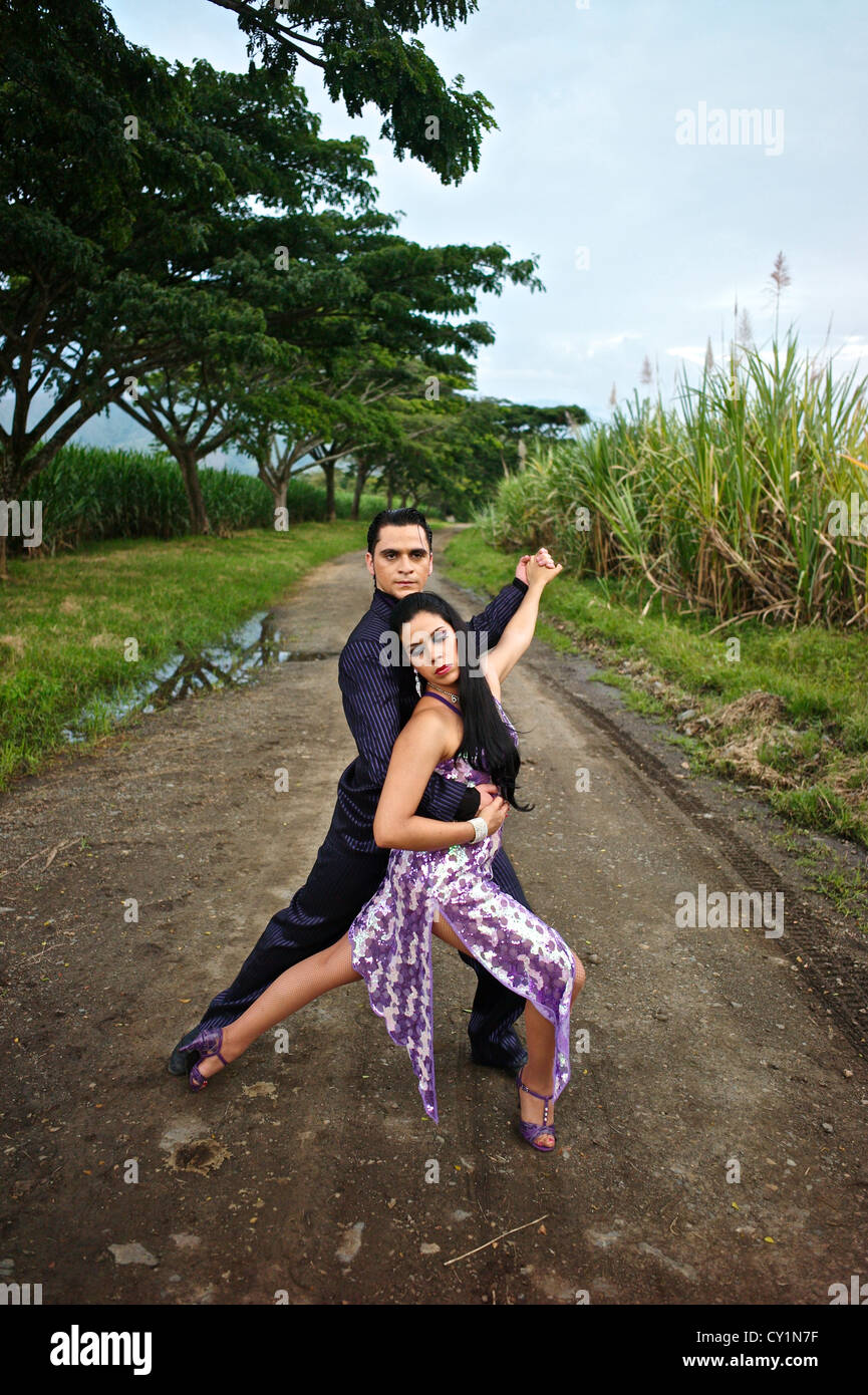 Colombian dancers perform the Salsa in a sugarcane plantation. Stock Photo