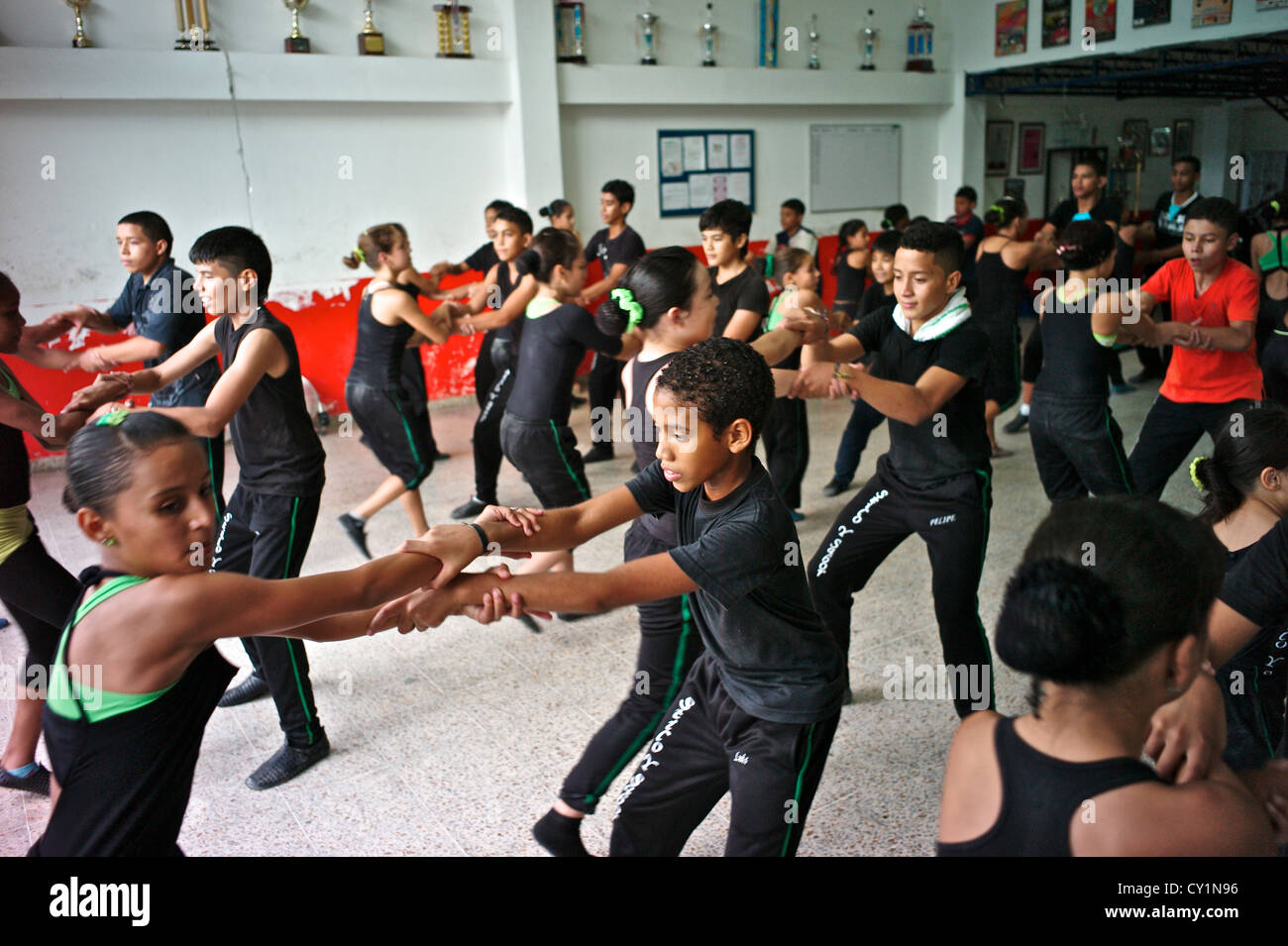 Young dancers practice the salsa at the Colombian academy for dance. Stock Photo