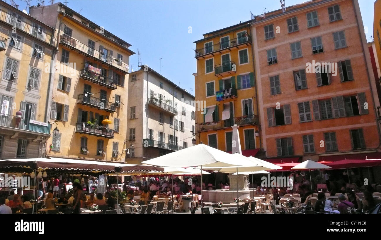 People gather for a meal in a plaza near the French Riviera. Stock Photo