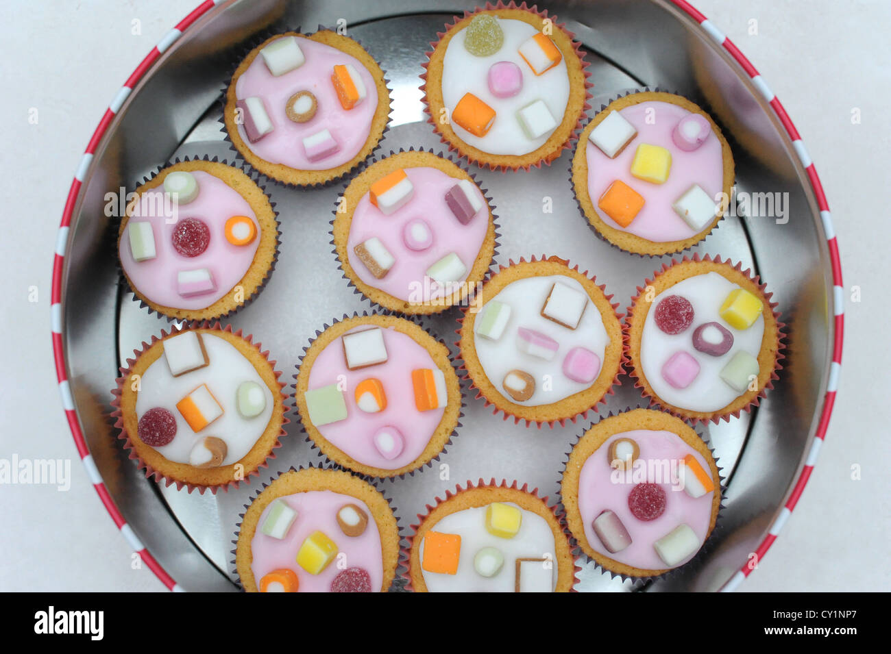 Dolly Mixture Cupcakes in cake tin Stock Photo Alamy