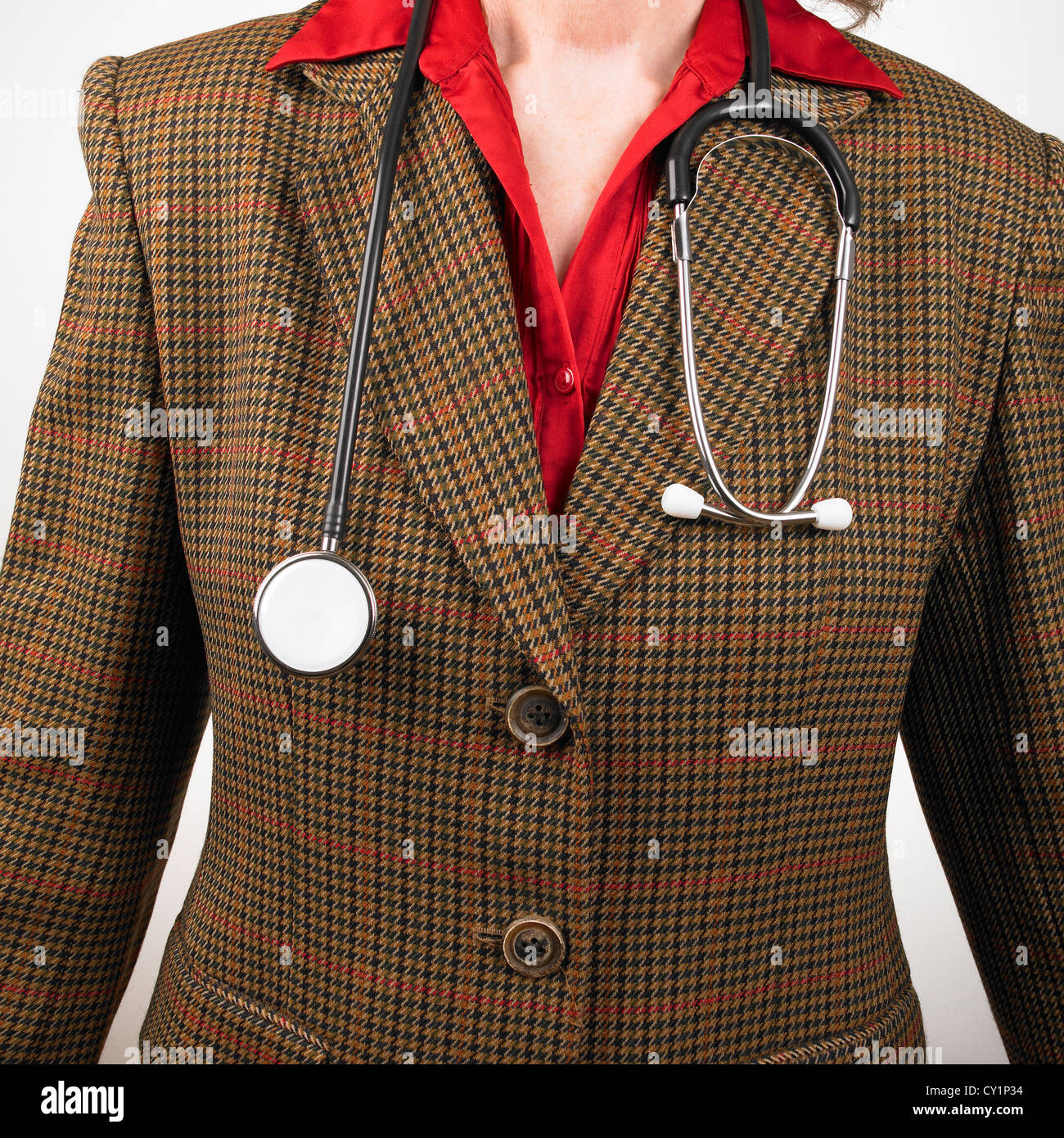 Woman GP wearing check pattern suit with stethoscope around neck Stock Photo