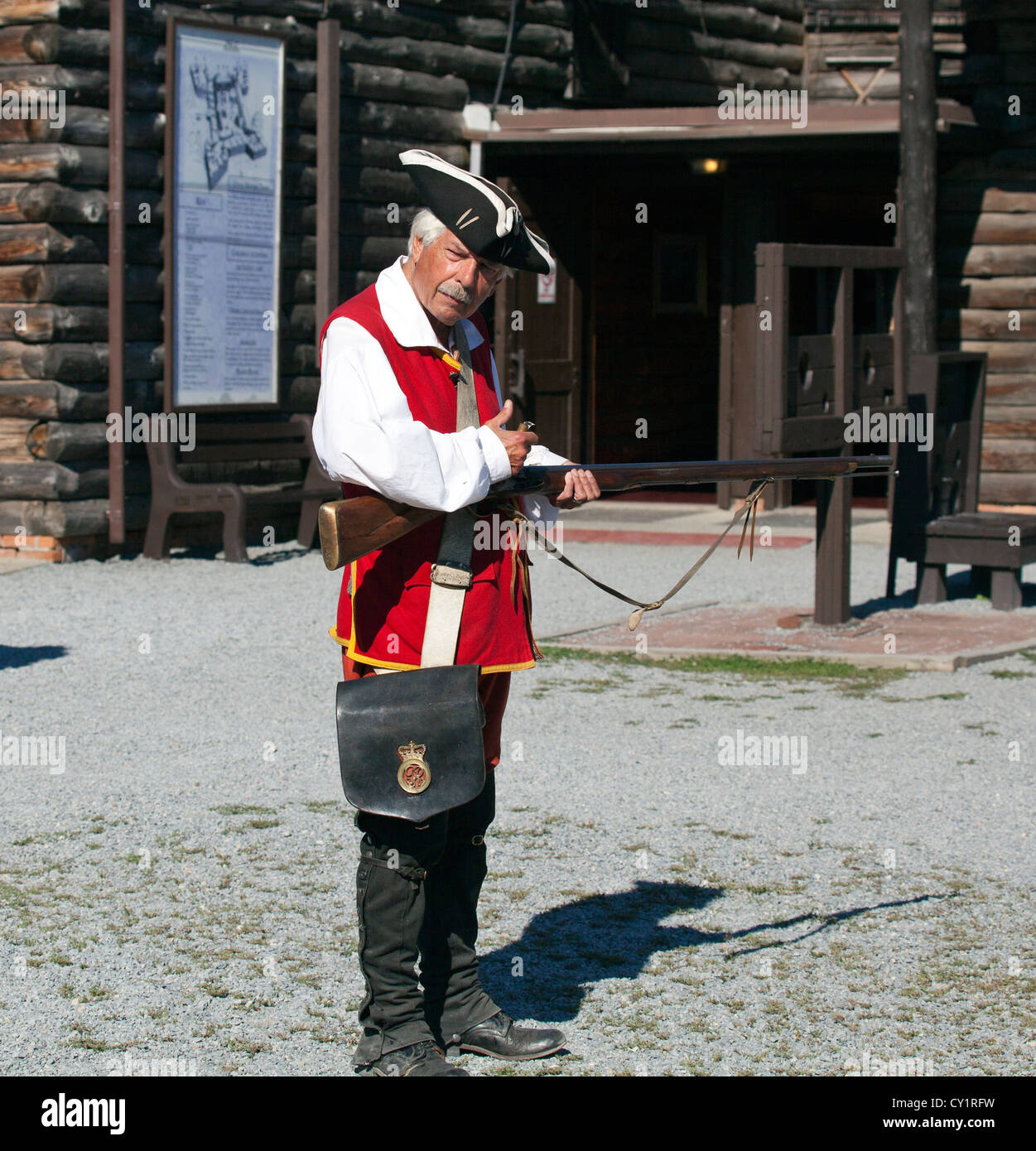 A British solder cocking his rifle brown bess at Fort William Henry New York. Stock Photo