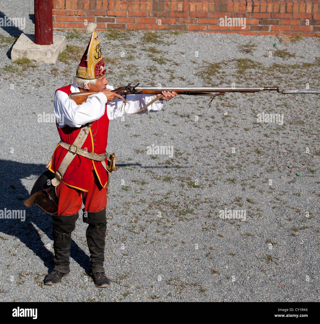 British Grenadier solder from the French and Indian War at Fort William Henry with his rifle at the ready. Stock Photo