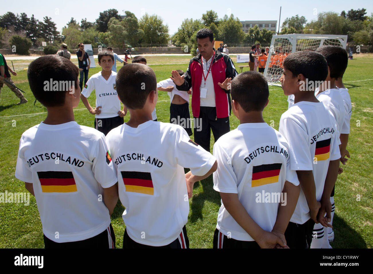 boys boy teams football player sports field child Stock Photo