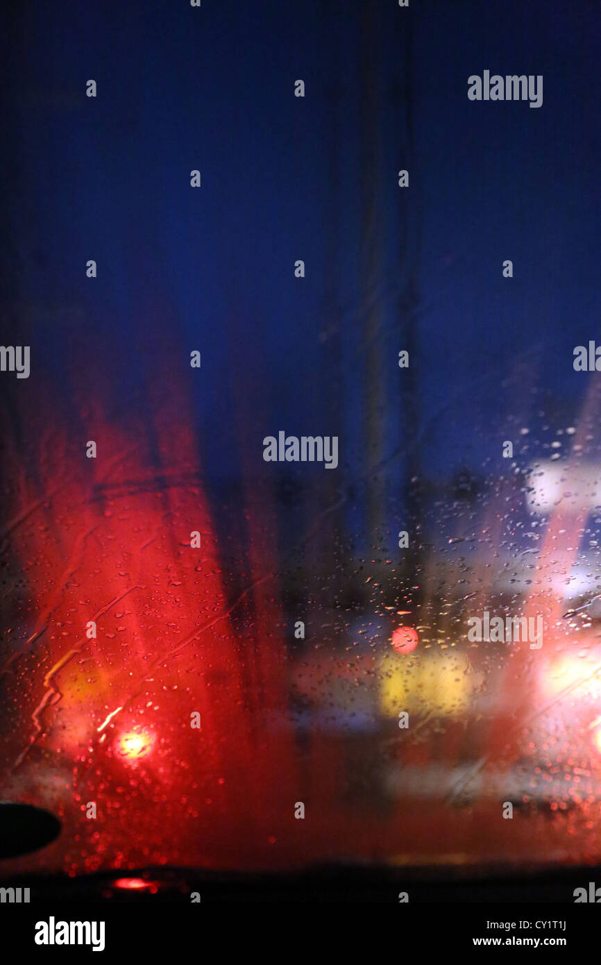 Lorry's Tail Lights At Night Through Car Windscreen In The Rain On
