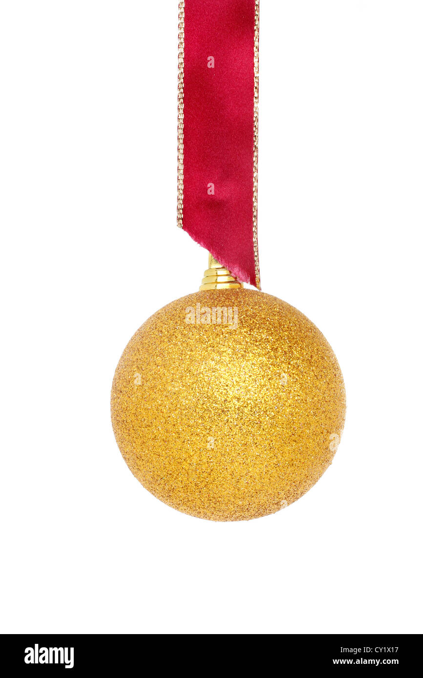 Gold glitter Christmas bauble hanging from a gold edged red ribbon isolated against white Stock Photo