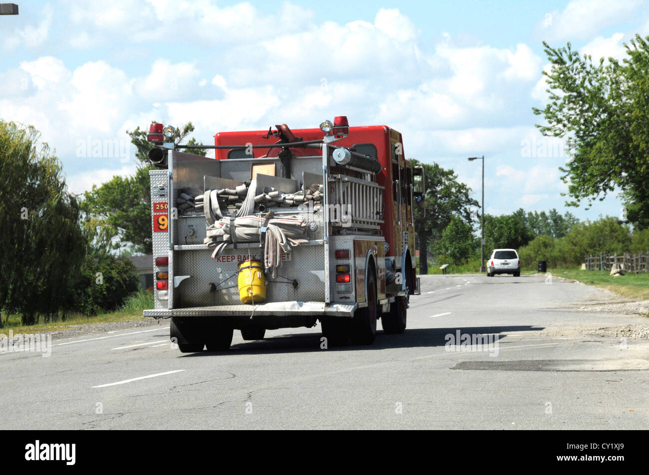fire truck riding non emergency down the road Stock Photo Alamy