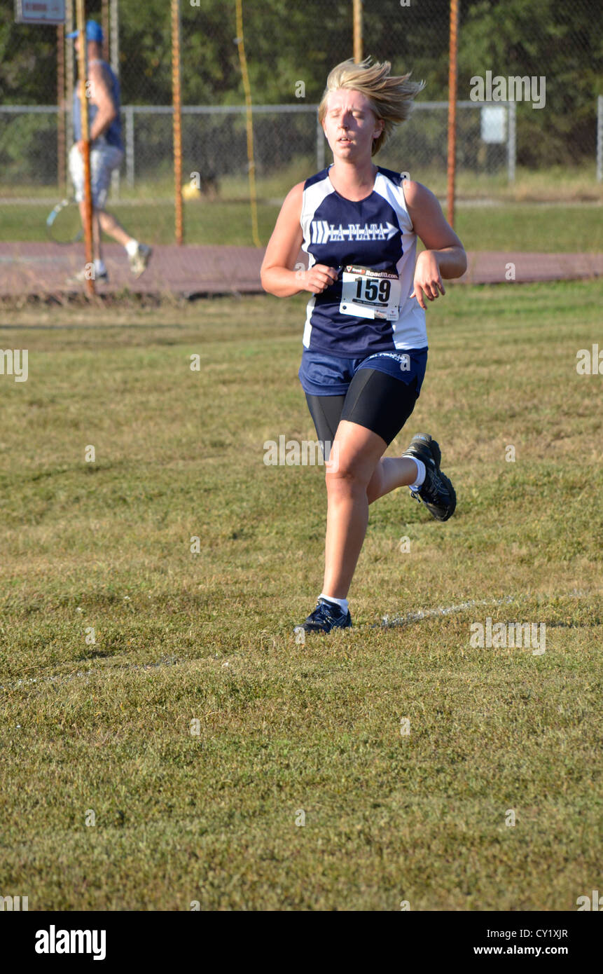 teenage girl running in a cross country meet in LaPlata, Maryland Stock  Photo - Alamy