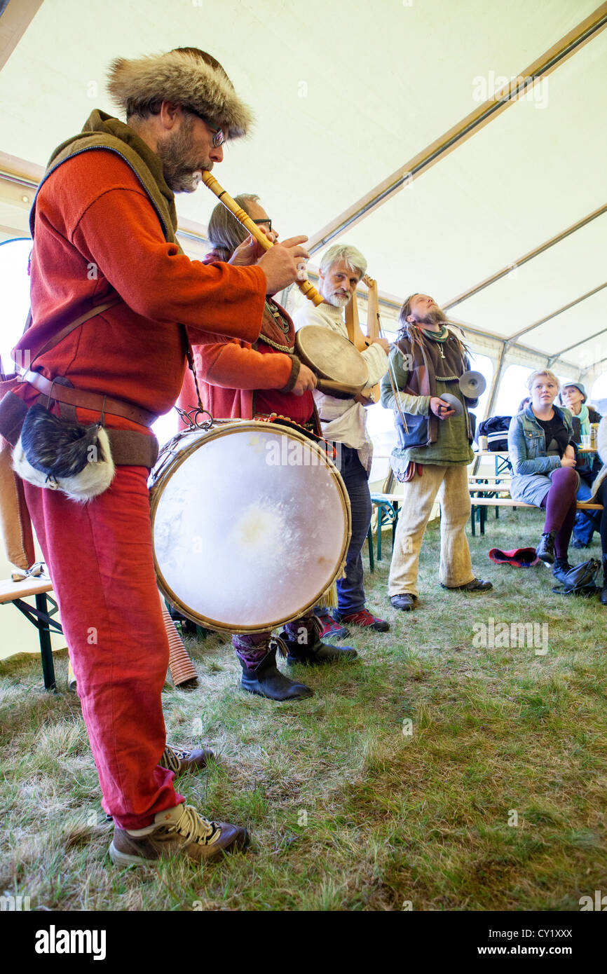 Musicians play during a gathering of an old Norse gods religious sect in Thingvellir in Iceland. Stock Photo