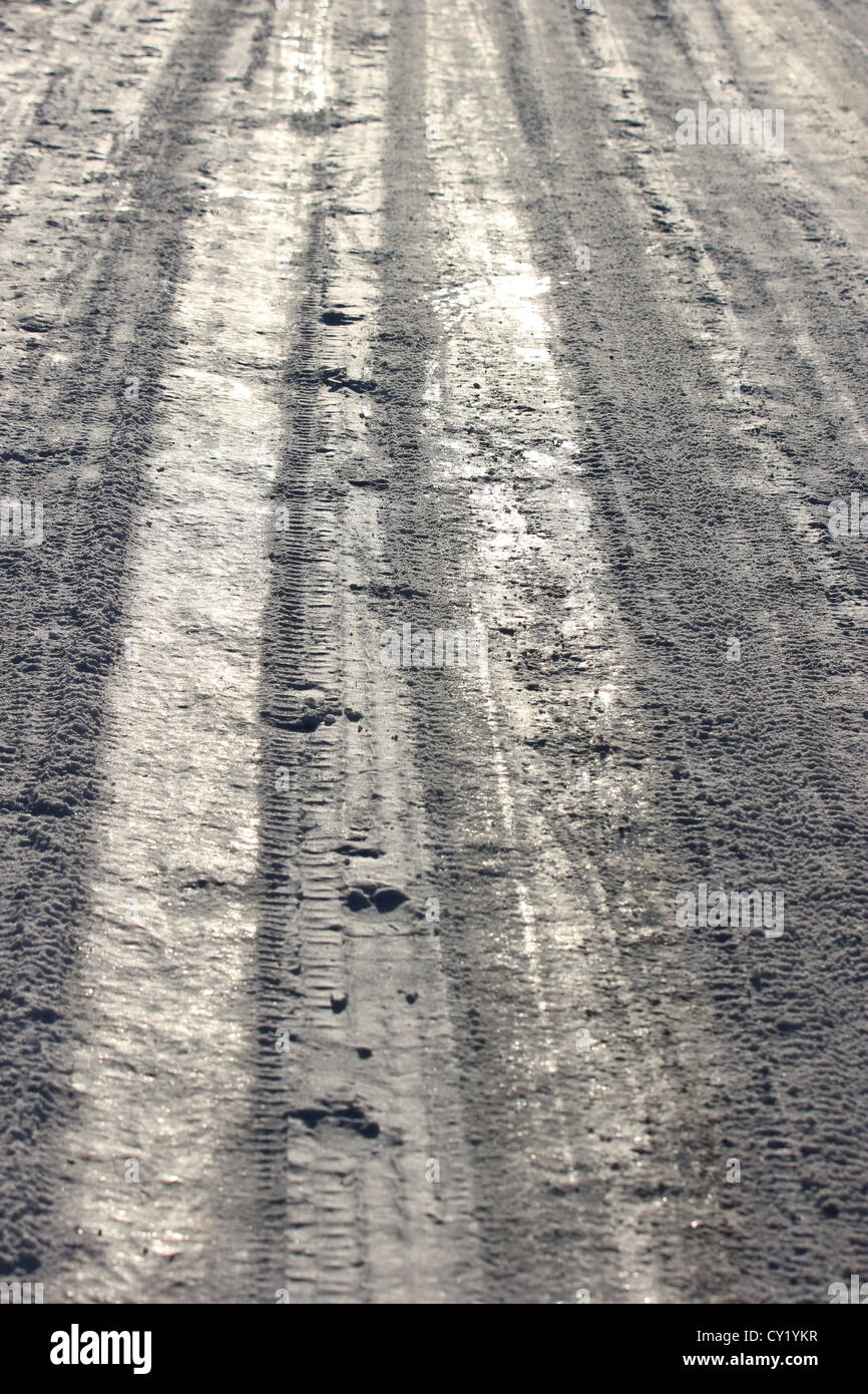 icy snowy road, road covered with snow, ice, mountain road, abstract, detail, winter season, car tracks on snow, photoarkive Stock Photo