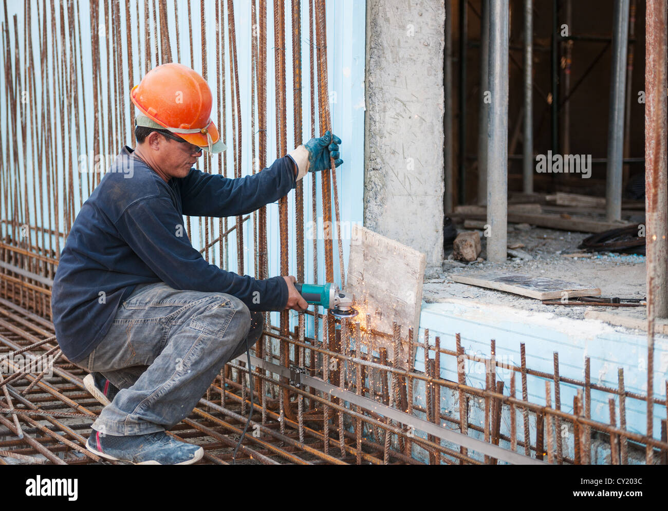Construction worker cutting steel rods Stock Photo - Alamy