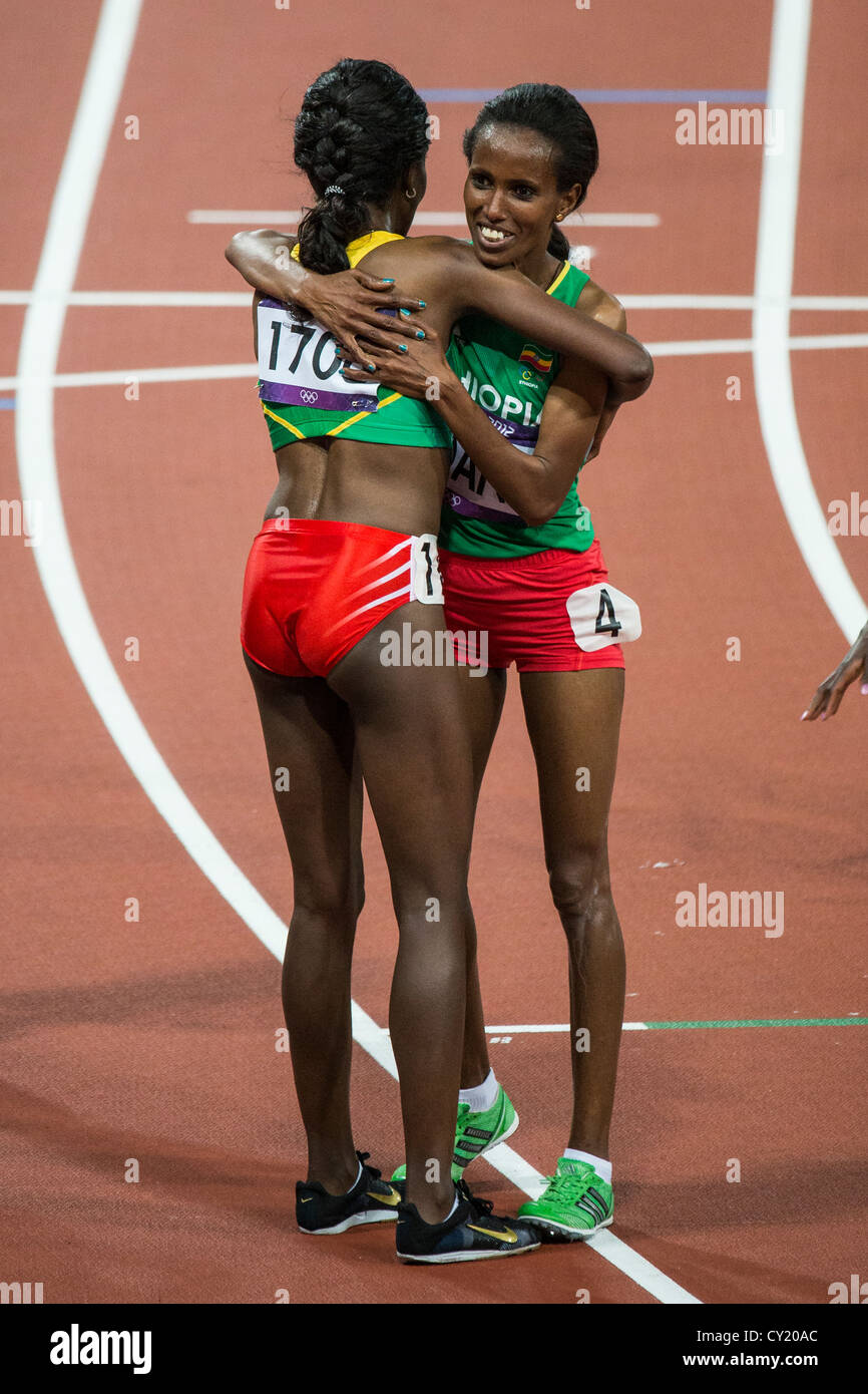 Tirunesh Dibaba (ETH) wins the gold medal in the women's 10000m and is congratulated by teammate Werknesh Kidane Stock Photo