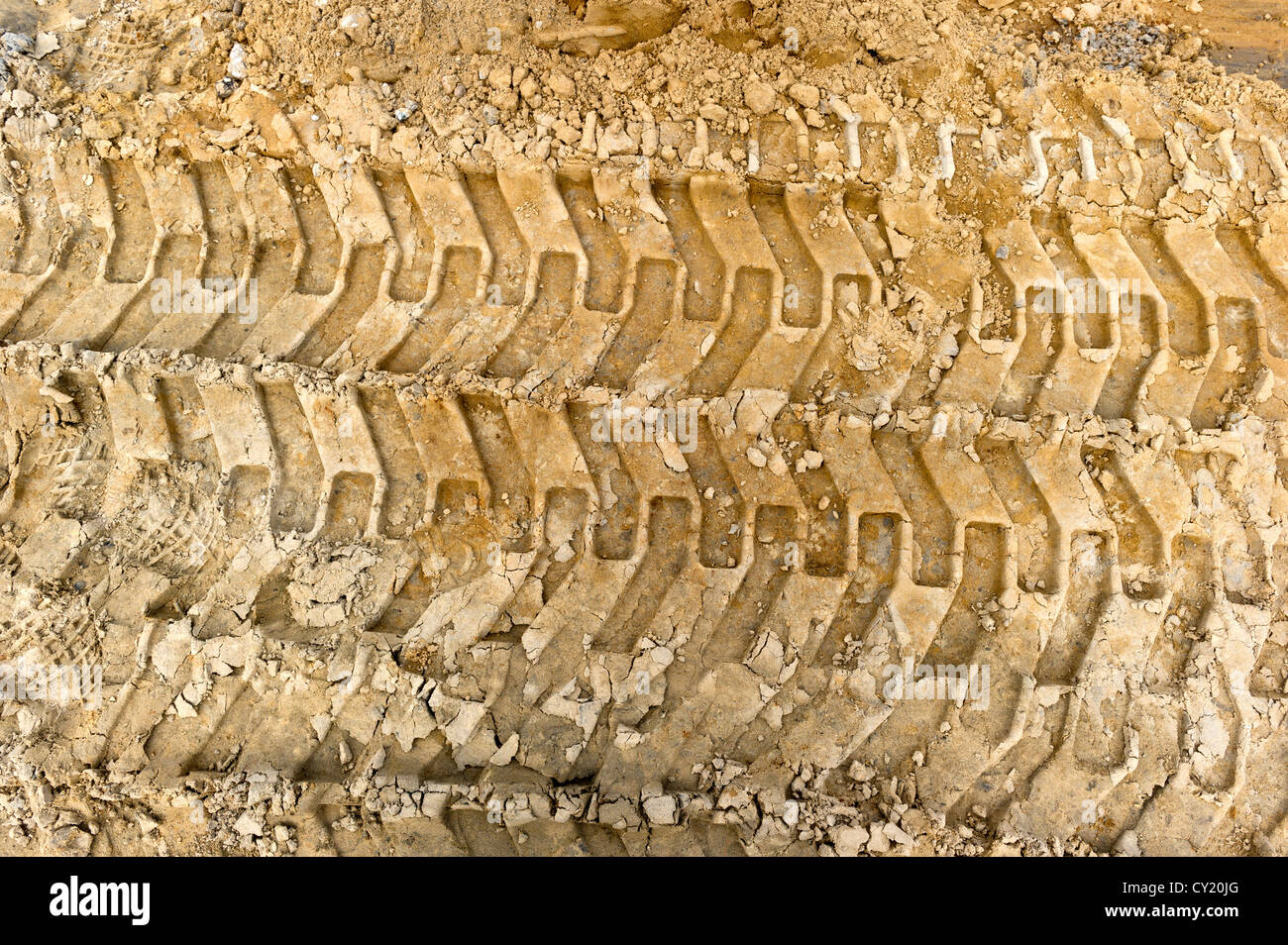 caterpillar tracks in sand Stock Photo