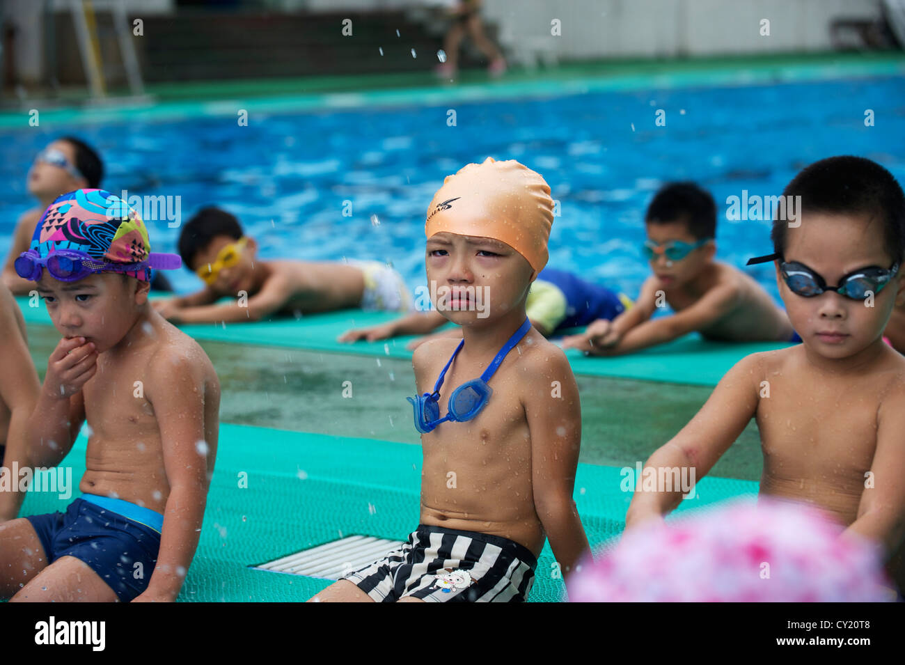 Chinese boy cries while training at summer swimming camps in Hangzhou