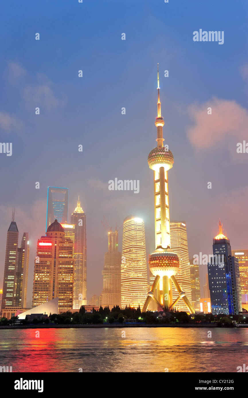 Shanghai city skyline at night over Huangpu river Stock Photo
