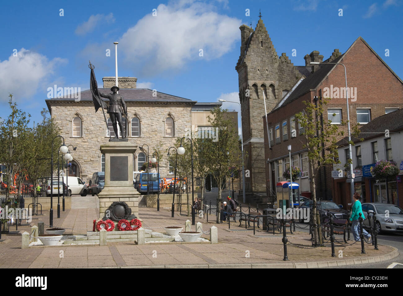 Dungannon Co Tyrone Northern Ireland War memorial in Market square with ornate former police barracks in right hand corner on lovely autumn day Stock Photo