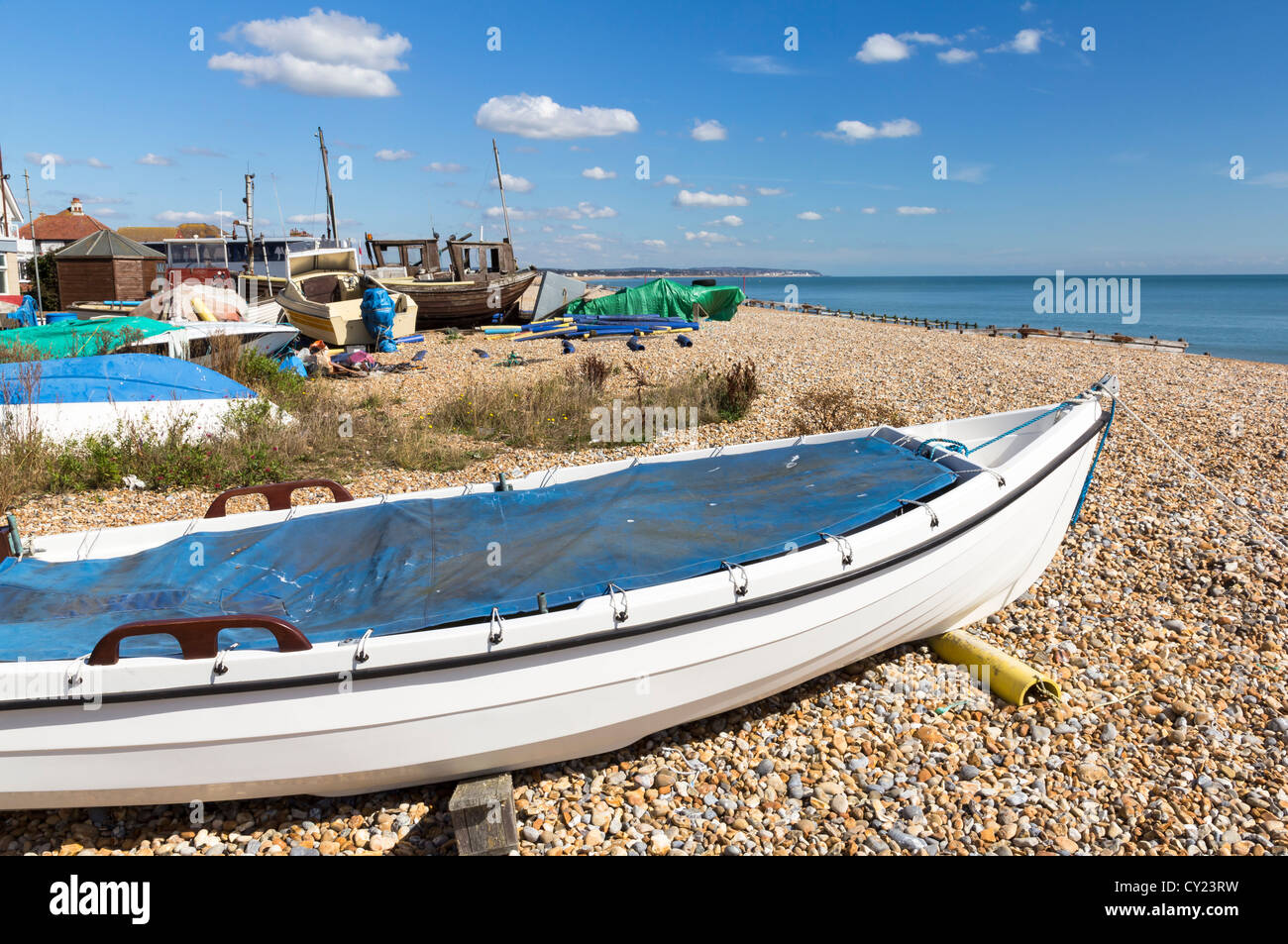 Boats on the beach at Pevensey Bay East Sussex England UK Stock Photo