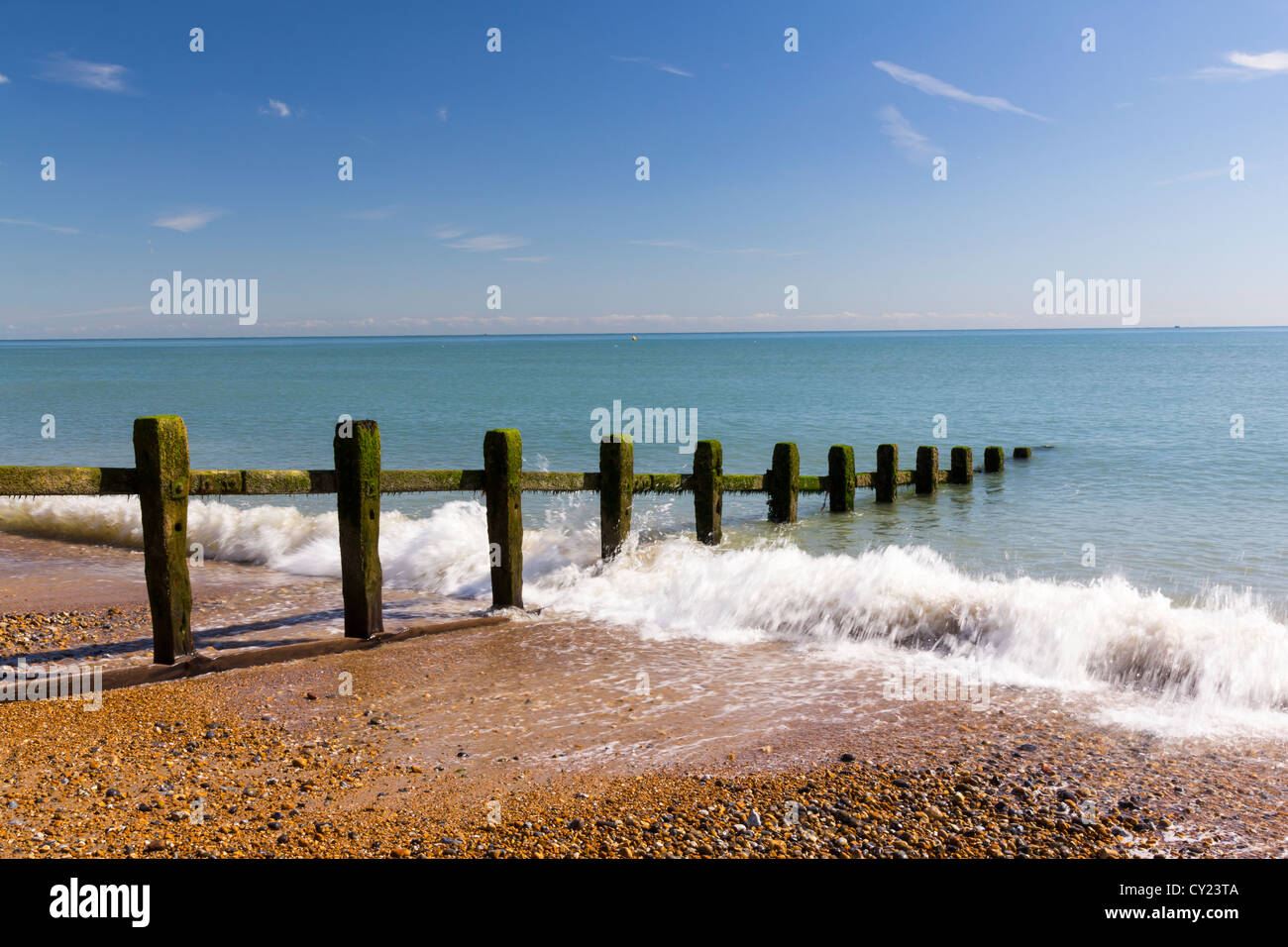 Waves on the beach at Pevensey Bay East Sussex England UK Stock Photo