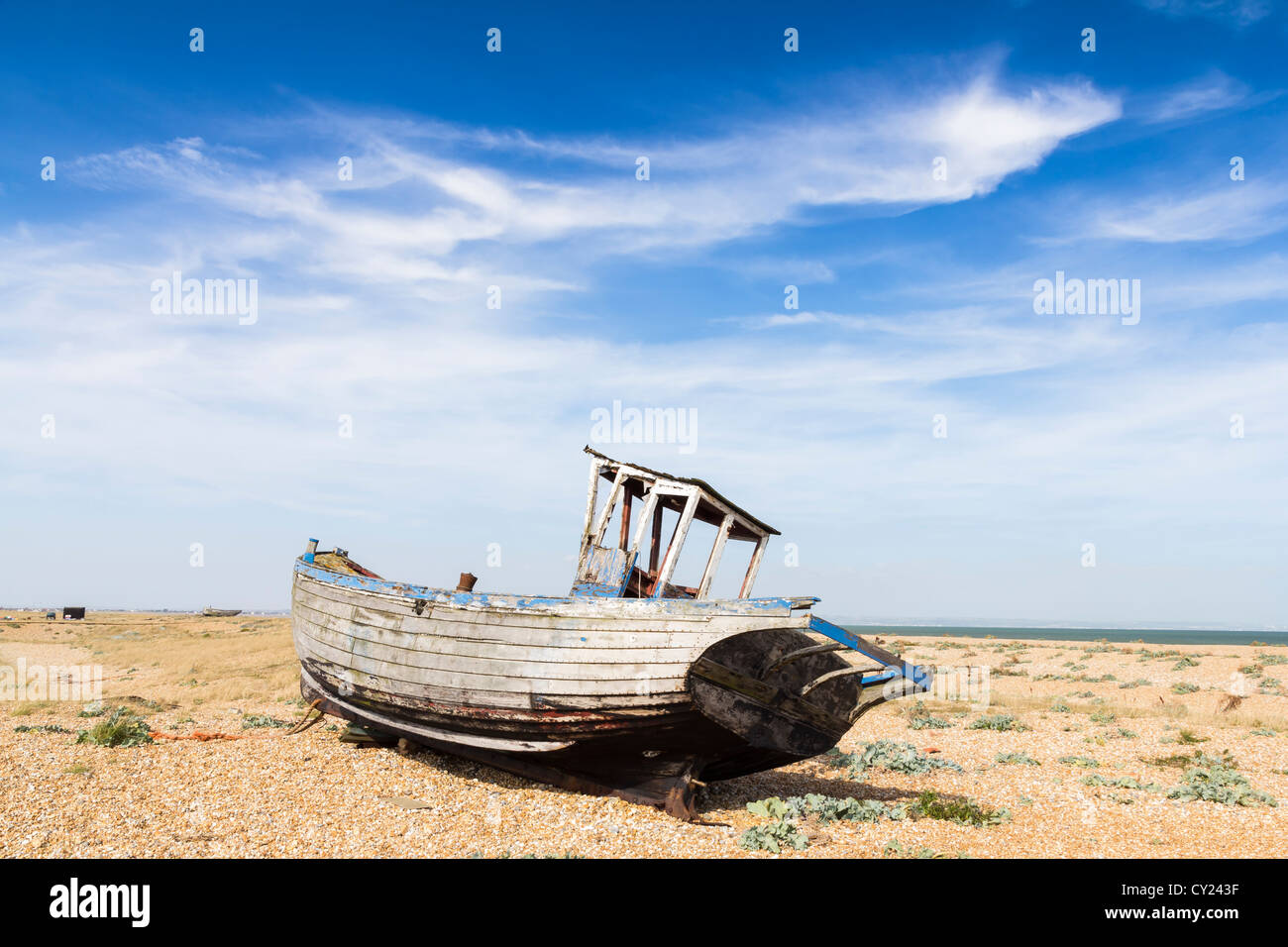 Abandoned boat on the shingle beach at Dungeness Kent England UK Stock ...