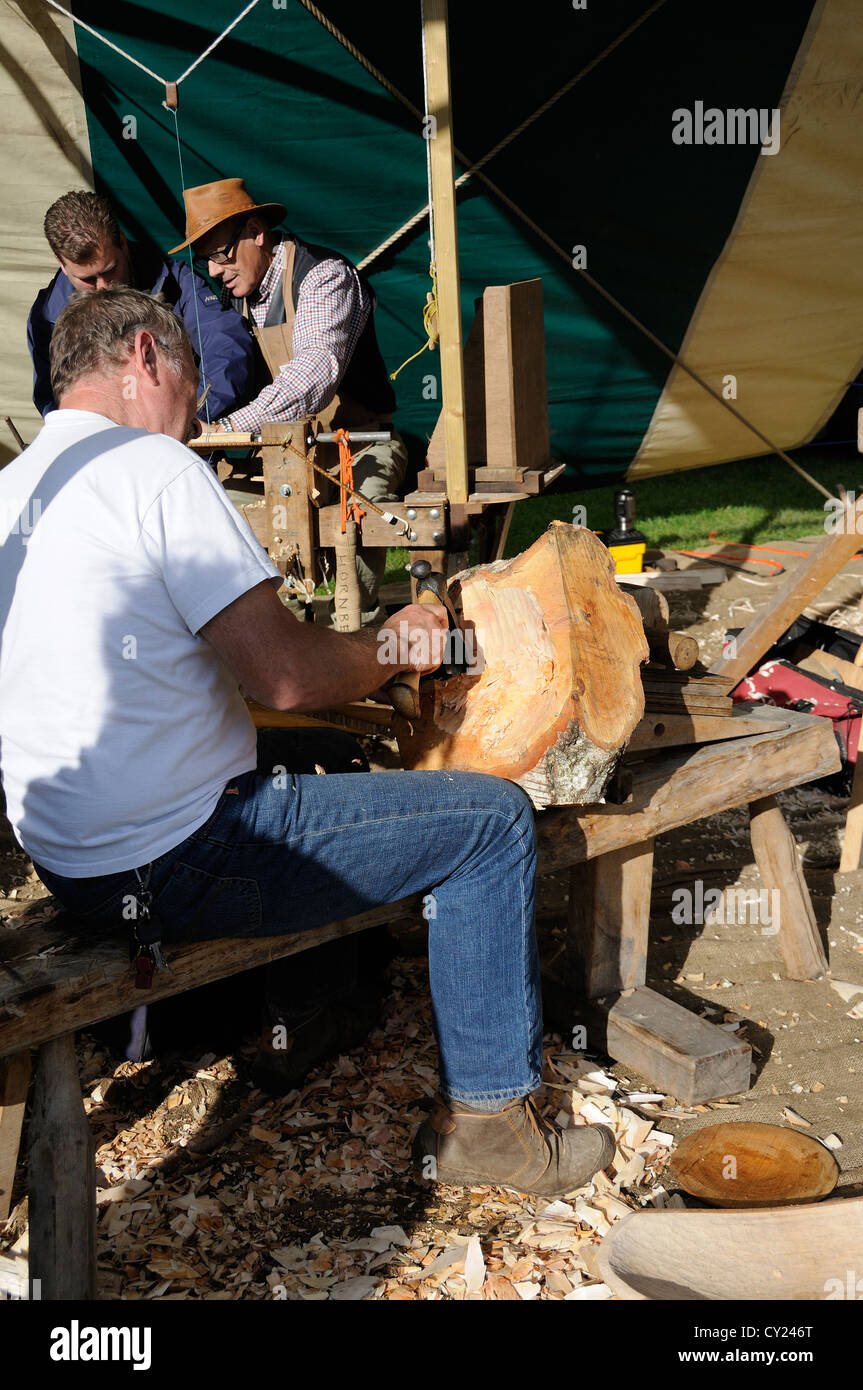 Wood sculpture and pole lathe turner demonstrations at Weald and Downland Open Air Museum, Singleton,Chichester, Stock Photo