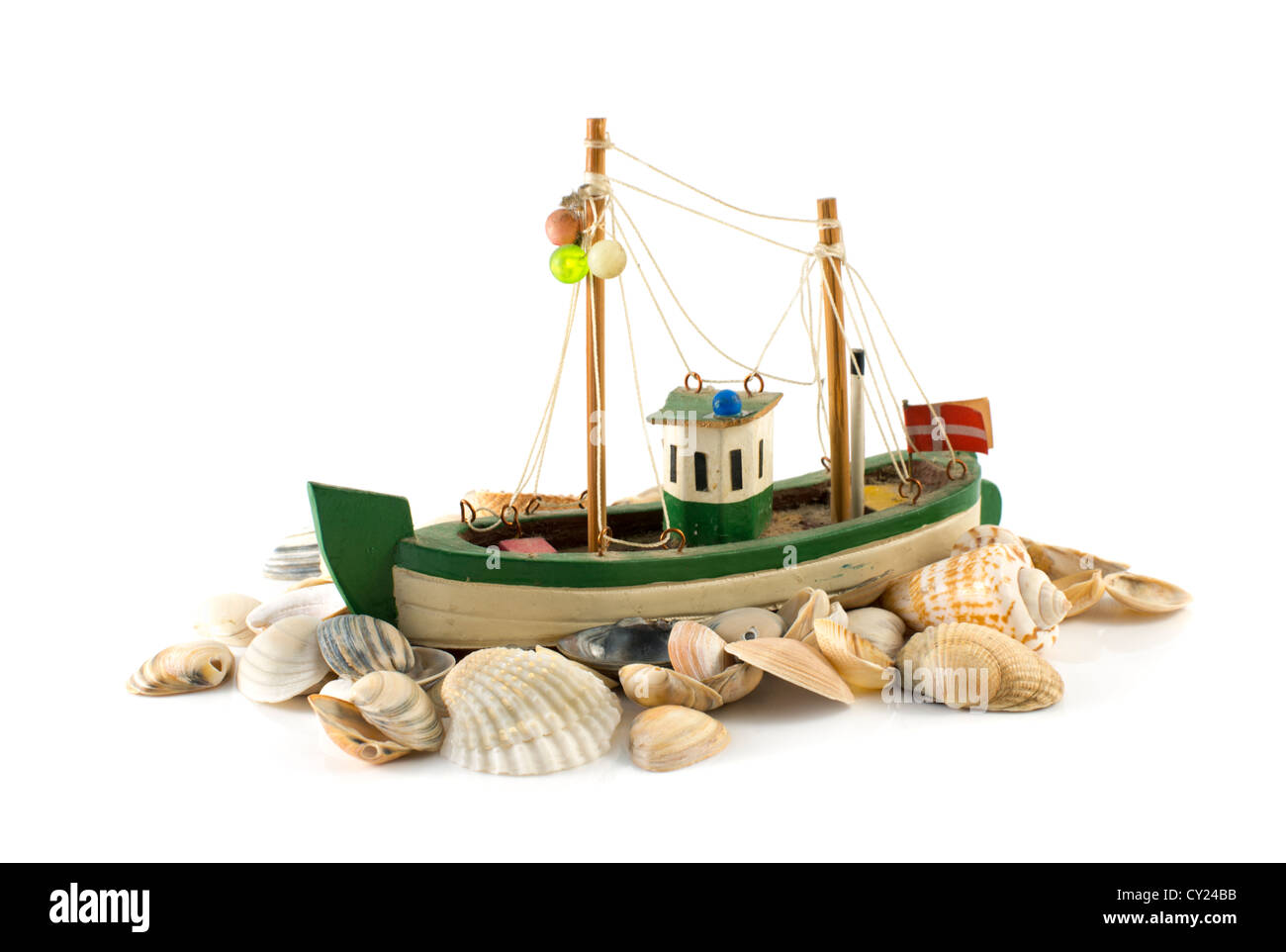 old danish model fish boat and beach shell isolated on white Stock Photo