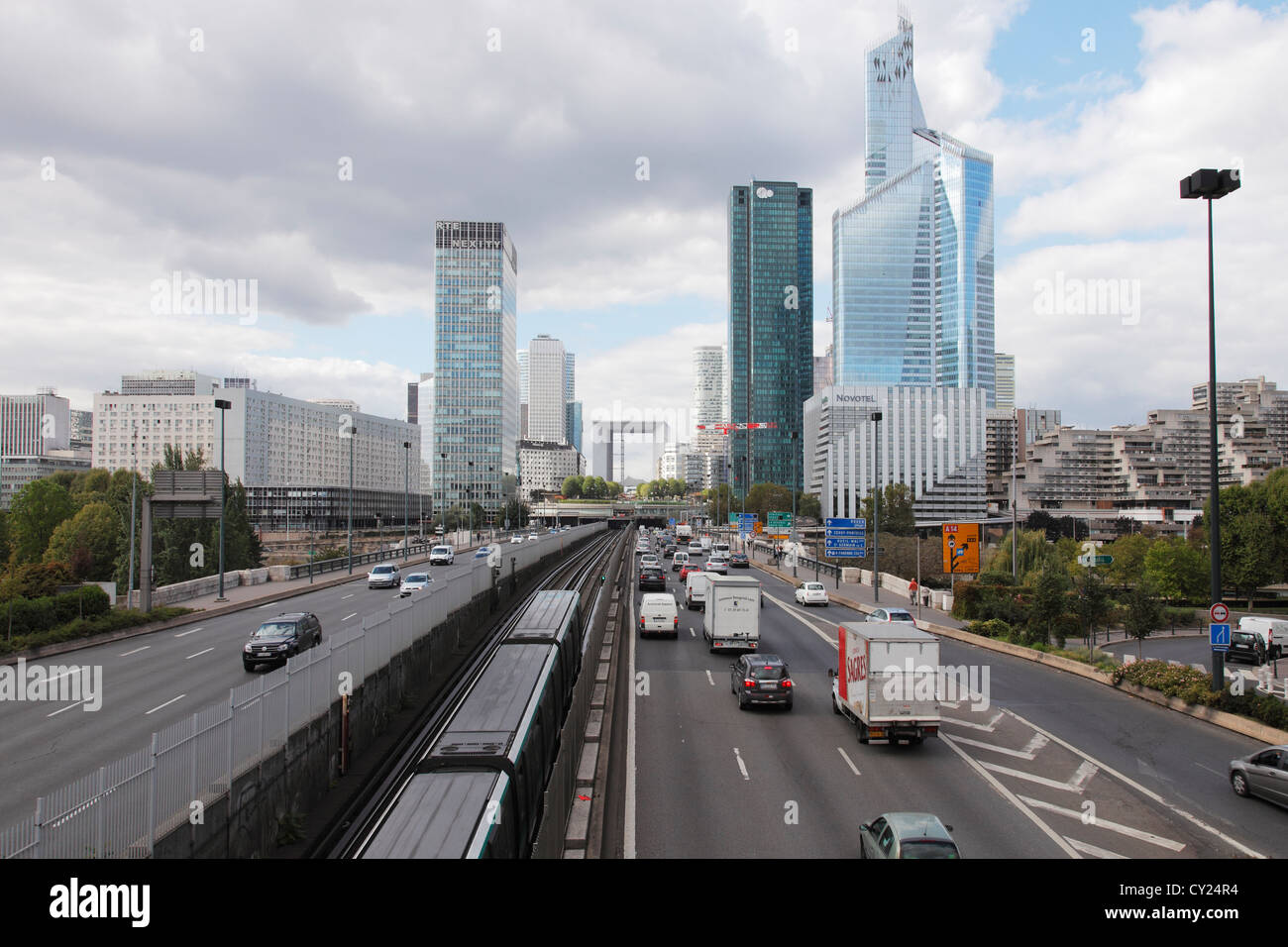 Av. Charles de Gaulle and skyline of La Défense in Paris with Tour First and La Grande Arche Stock Photo