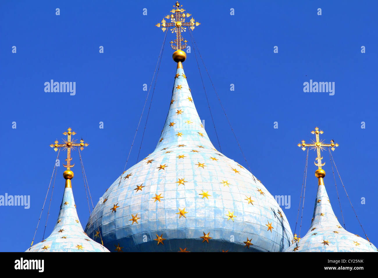Blue church cupolas with golden stars and crosses Stock Photo