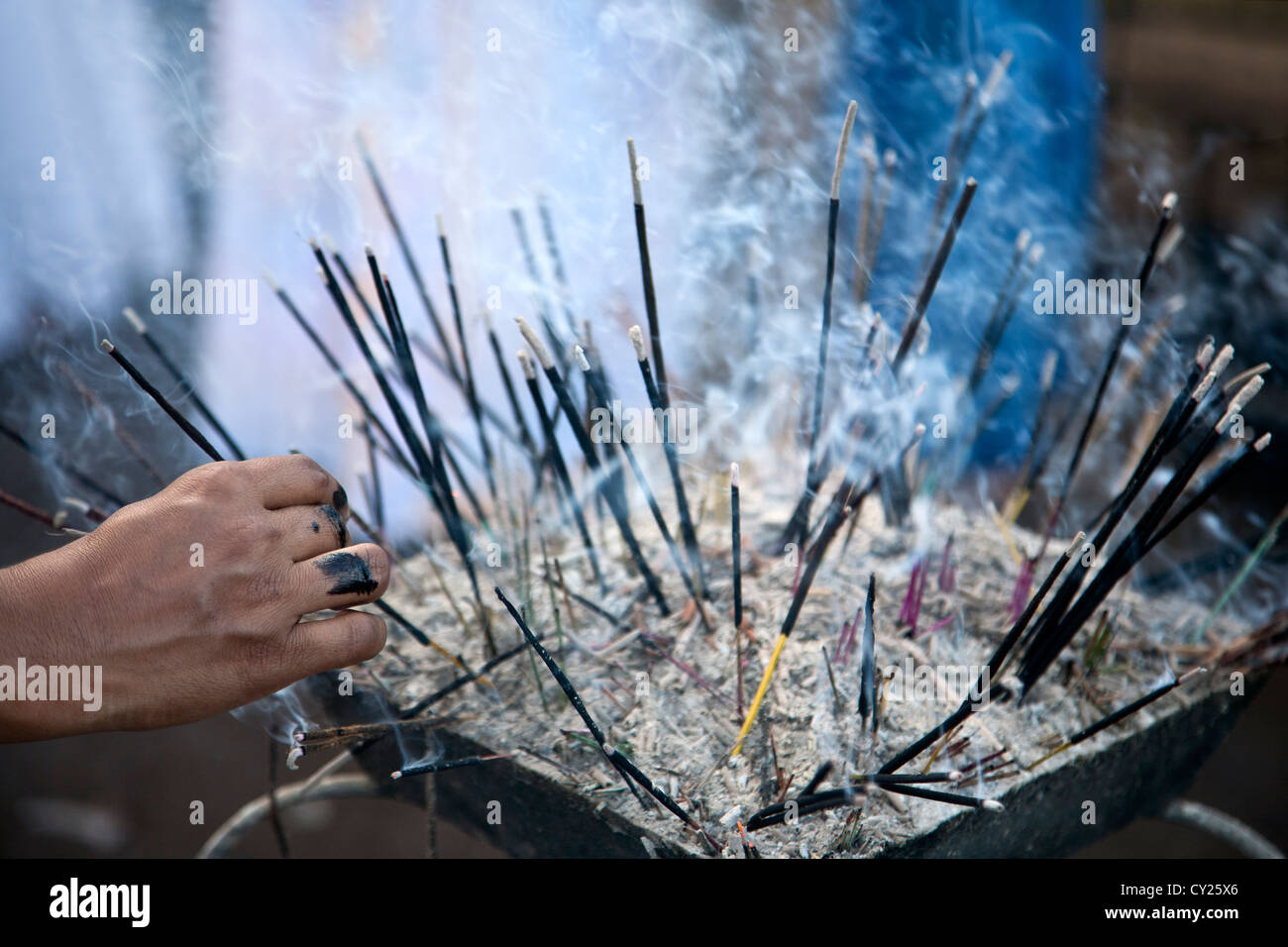 Burning incense sticks. Temple of the Sacred Tooth Relic. Kandy. Sri