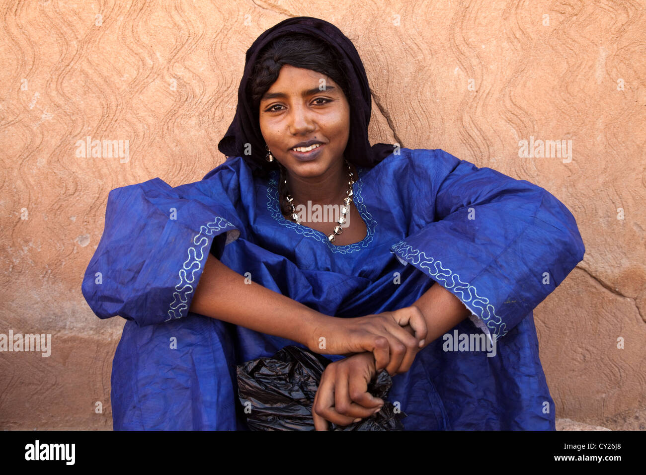Portrait of a young Tuareg woman wearing a blue dress, Ingal, Niger, Africa Stock Photo