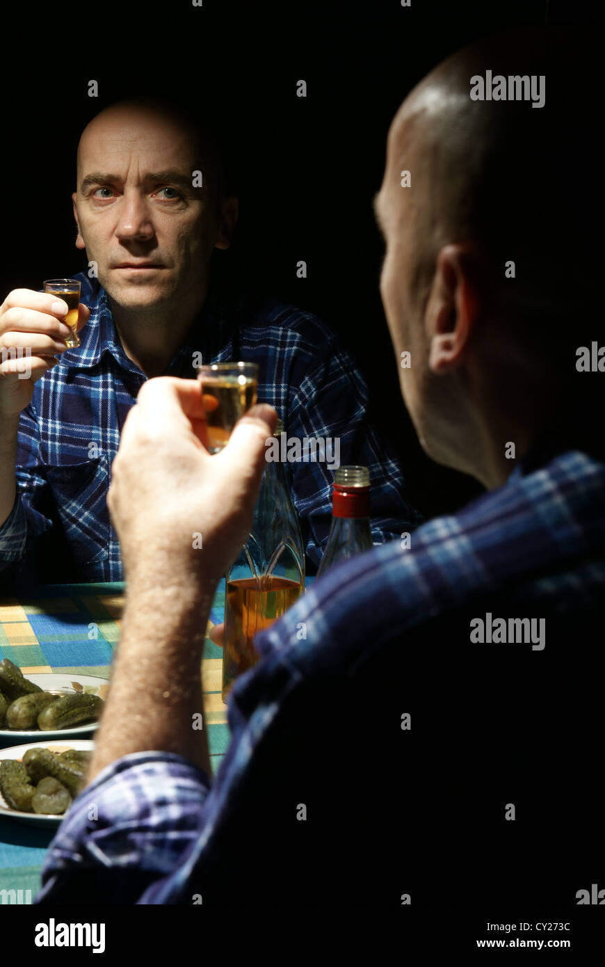 lonely drinking man with reflection in mirror Stock Photo