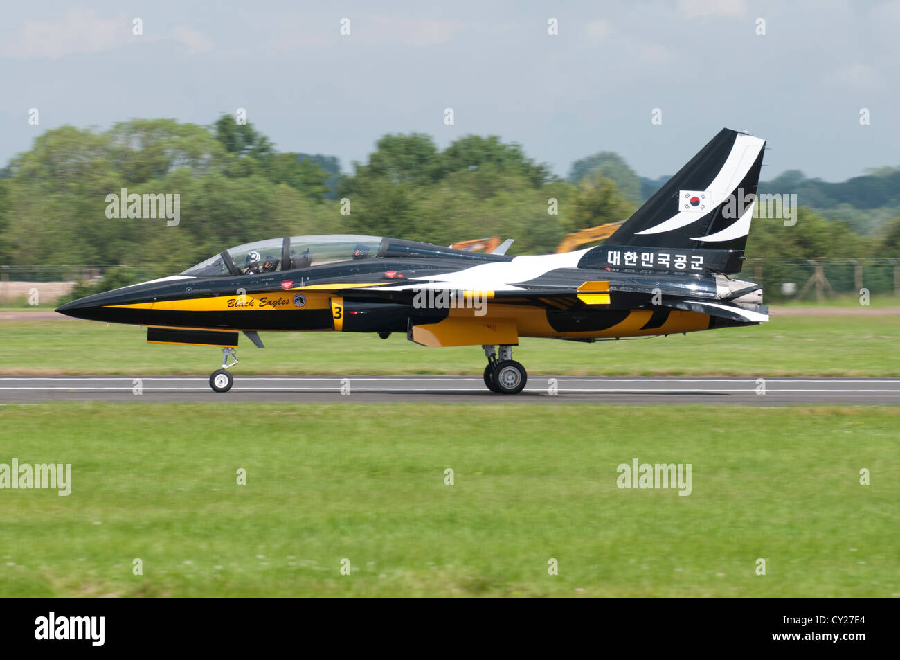 A Korean T-50B Golden Eagle Military Jet Trainer from the Black Eagles display team slows down after landing at the 2012 RIAT Stock Photo