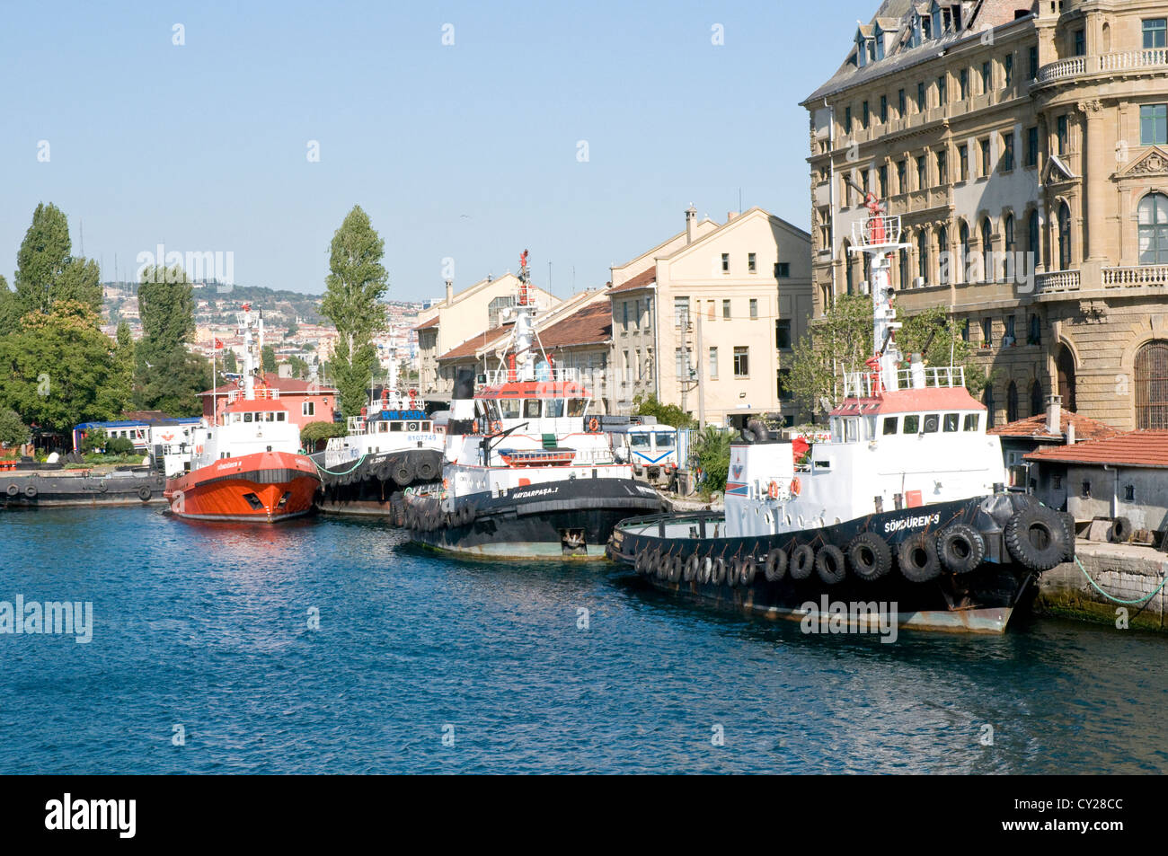 Tugboats at the port of Kadikoy (Kadıköy), on the Sea of Marmara and the Asian side of the Golden Horn, in the city of Istanbul, Turkey. Stock Photo