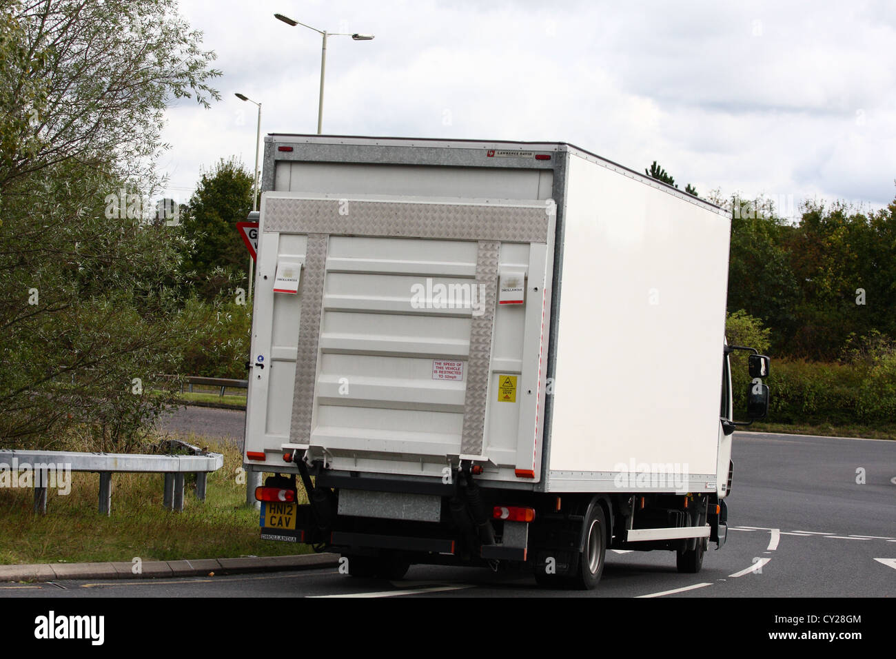 An unmarked truck traveling along a road in England Stock Photo