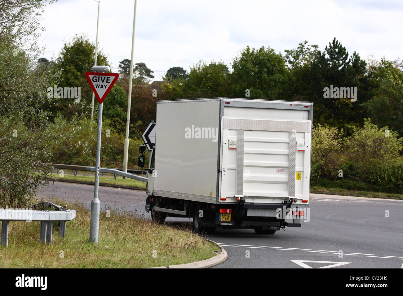 An unmarked truck traveling along a road in England Stock Photo